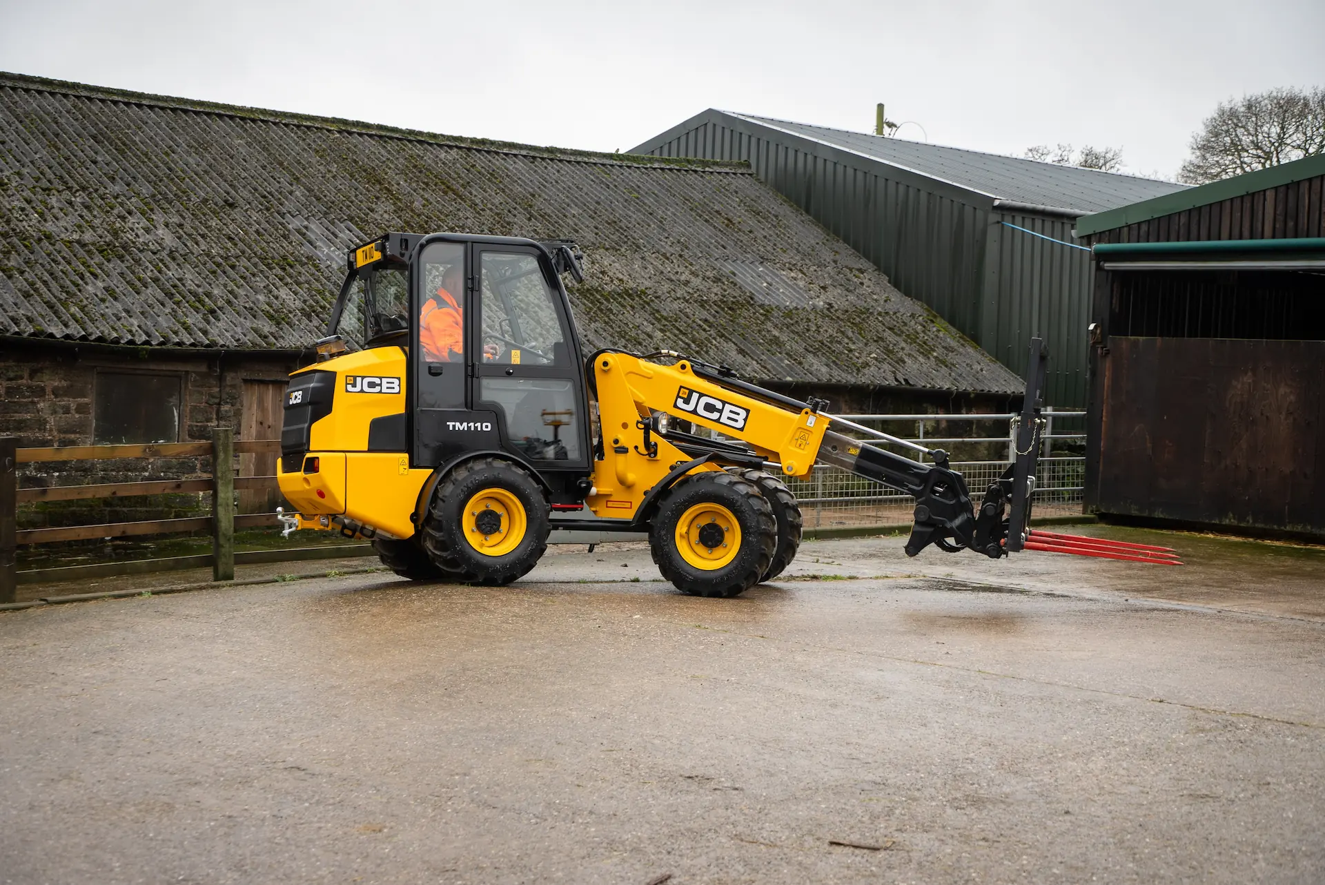 A new JCB yellow fork lift used on farms for moving hay bales