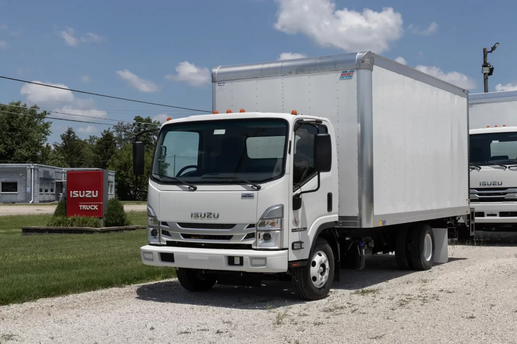 A new Isuzu truck parked with a pantec style body fitted.