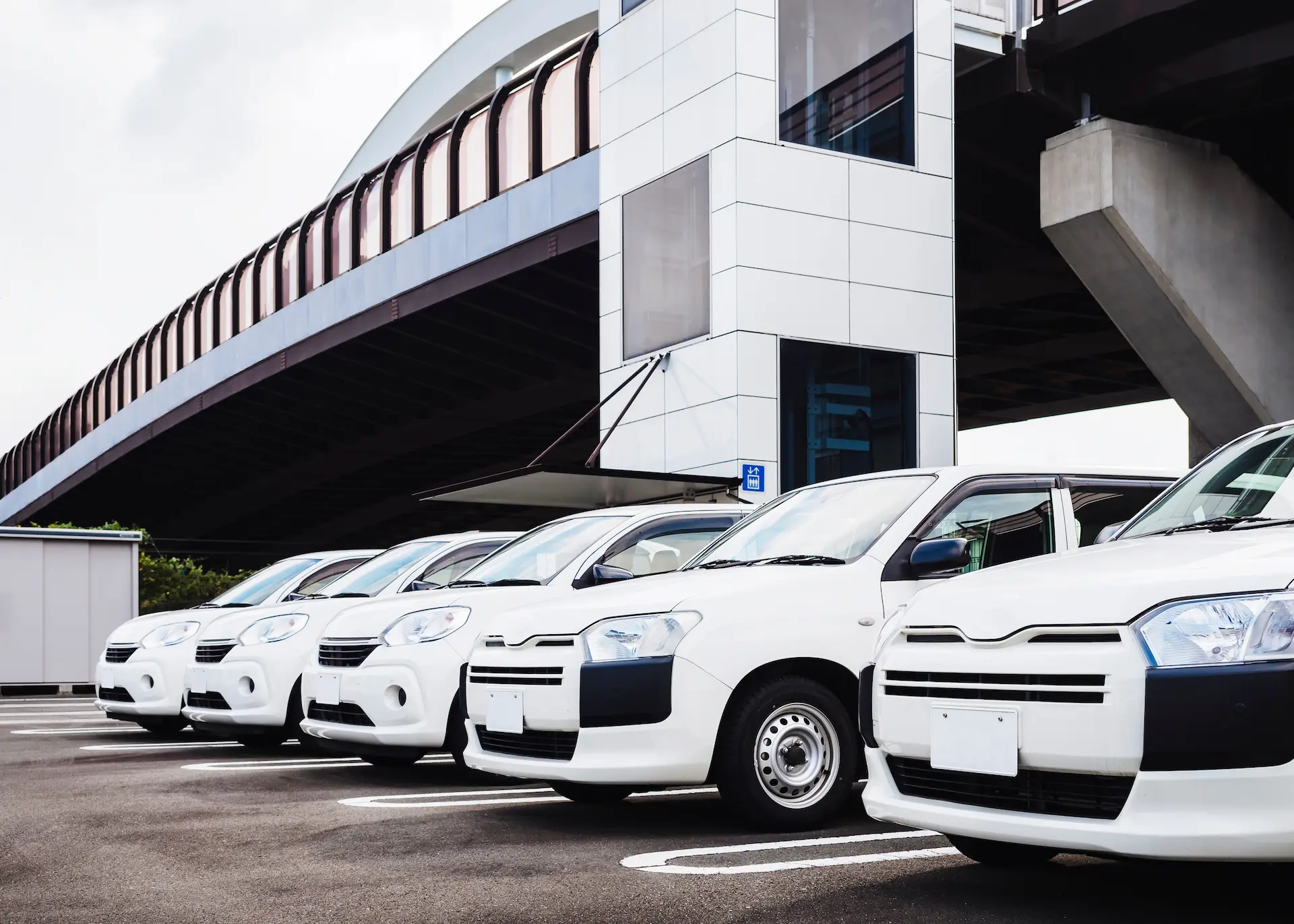 A line of company vehicles parked